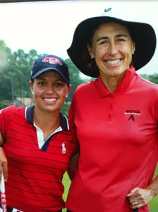 Alison Hovatter poses for a picture with Christa Johnson, who has won nine LPGA tournaments, including one major.