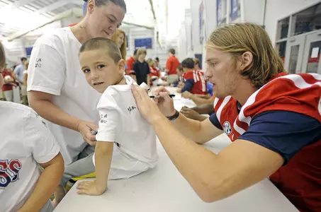 Bo Wallace signs an autograph at Meet the Rebels Day. (photo by Thomas Graning)