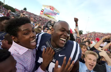 Laremy Tunsil celebrates with fans after the Rebels' win over Alabama. (photo by Joshua McCoy)