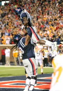 Justin Bell and Jaylen Walton celebrate a touchdown in the 34-3 win over Tennessee. (photo by Joshua McCoy)