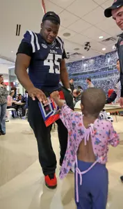 Lavon Hooks greets a patient at Scottish Rite Children's Hospital