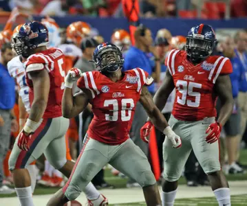Shackelford celebrates a big play in the season opener vs. Boise State. (photo by Joshua McCoy)