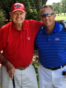 Dr. Gerald `Doc' Hollingsworth (left), a longtime donor to OIe Miss Athletics, spends time with head football coach Hugh Freeze.