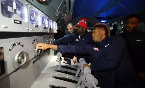 Christian Russell, Damarkus Lodge and other Rebels enjoy a simulated submarine experience at the National World War II Mseum in New Orleans. (photo by Joshua McCoy)