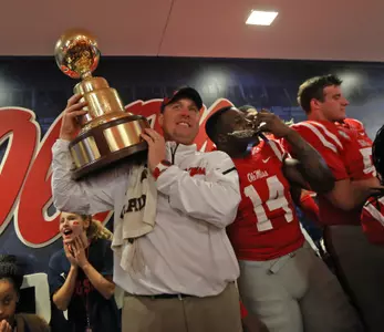 Hugh Freeze celebrates after the Rebels' 2014 Egg Bowl victory. (photo by Joshua McCoy)