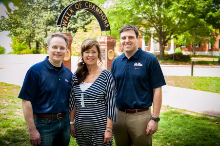 Steven and Kim Boatwright of Millington, Tenn., from left, visit with Evin Beck, director of development for the Ole Miss Athletics Foundation. The Boatwrights have provided a major gift to the Vaught Society/Forward Together campaign to help Ole Miss teams of all sports have a competitive edge.