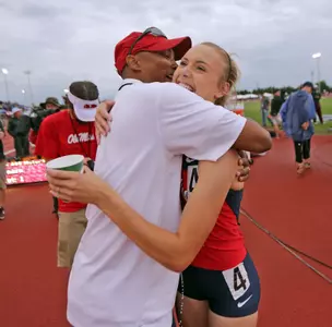 Head coach Brian O'Neal congratulates Brooke Feldmeier after her SEC victory (photo by Joshua McCoy)