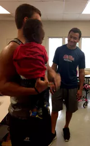 Evan Engram visits with children at the C.M. Scott Center in Oxford.