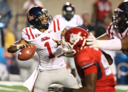 Ole Miss QB Randall Mackey throws against the Fresno State defense in the second quarter of the Rebels' 38-28 win on Oct. 2, 2011. (AP Photo/Gary Kazanjian)