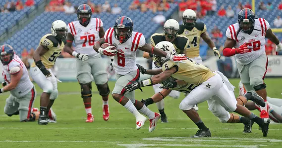 Jaylen Walton sheds a tackler on his way to the end zone against Vanderbilt last season. (photo by Joshua McCoy)