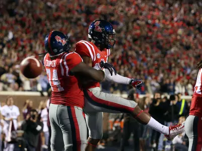Fahn Cooper and Cody Core celebrate a big play in the 2014 Egg Bowl win over Mississippi State (photo by Joshua McCoy)