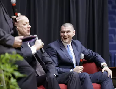 Jim Kelly and Chad Kelly speak at the 2016 Ole Miss FCA Breakfast at Tad Smith Coliseum. (Photo by Ellen O'Nan/Ole Miss Athletics)