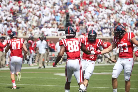 Matt Brown (87) and Dillon Barrett (83) celebrate a big play last fall. (photo by Joshua McCoy)