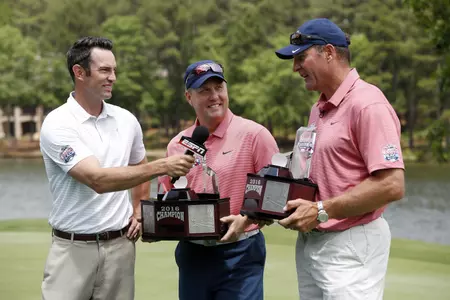 ESPN reporter Peter Burns interviews Hugh Freeze and Wesley Walls after Team Ole Miss captured the championship of the 2016 Chick-fil-A Peach Bowl Challenge at the Oconee Course at Reynolds Landing, on Tuesday May 3, 2016, in Greensboro, Georgia. (Paul Abell - Abell Images for the Chick-fil-A Peach Bowl Challenge)