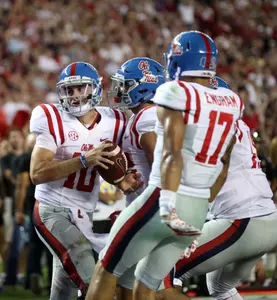 Chad Kelly (far left) and Evan Engram (far right) were named preseason All-SEC Thursday morning