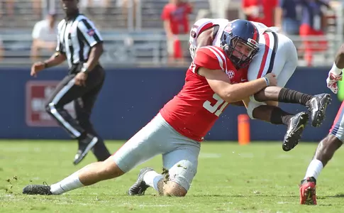 Nathan Noble tackles a Georgia player on a kickoff. (photo by Petre Thomas)