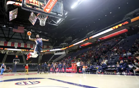 Rebel newcomer Markel Crawford soars through the air during the dunk contest at the second annual Dunk or Treat, Oct. 27.