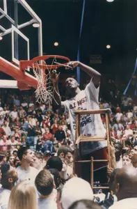 Ansu Sesay cuts down the nets following the Rebels' 74-68 win over LSU that propelled them to the 1997 SEC Western Division title.
