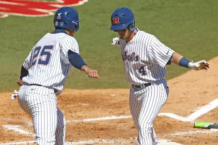 Colby Bortles (left) and Tate Blackman (right) celebrate a home run against UT Martin last season.