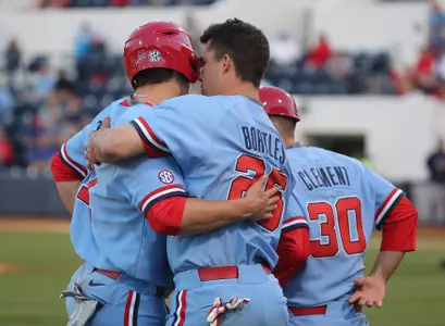 Team captain Colby Bortles (right) gives advice to teammate Chase Cockrell (left) during a game earlier this season.