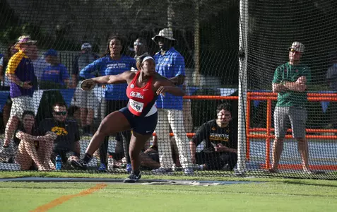Janeah Stewart had personal bests in all three of her throwing events, including a school record in the hammer. (photo by Allison Curry)