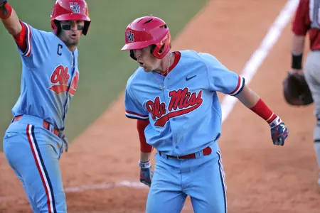 Tate Blackman (left) and Will Golsan (right) celebrate after Golsan's two-run homer in Sunday's win over Alabama.