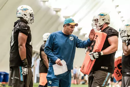 Jack Bicknell Jr. (center) - Photo courtesy of the Miami Dolphins