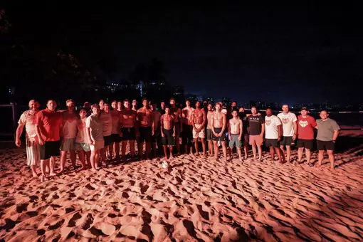 Ole Miss men's basketball team playing sand volleyball