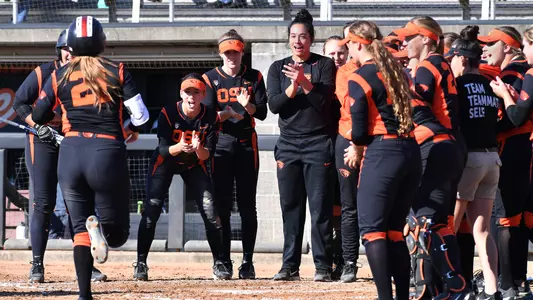 Team celebrating a home run vs Clark