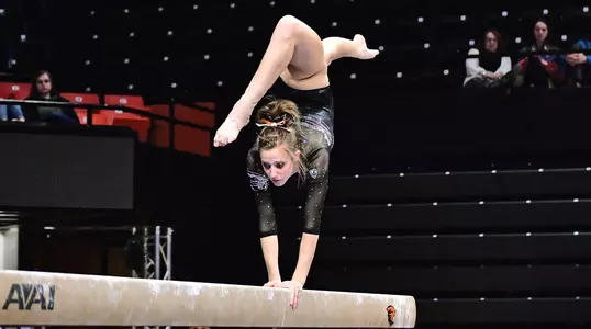 McKenna Singley - beam - Orarnge & Black