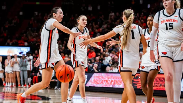Jenna Villa and Kennedie Shuler celebrate a made basket