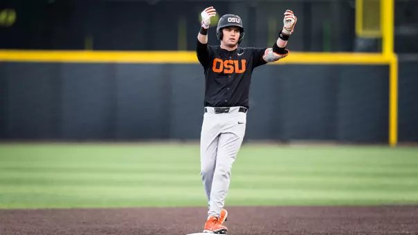 Ethan Porter celebrates after hitting a double against Oregon