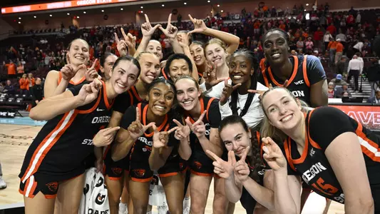 Team holding up W's after beating LMU