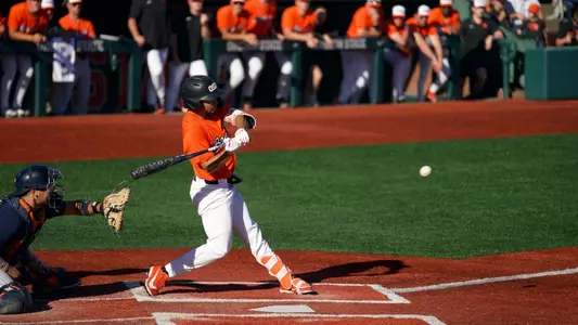 AJ Singer takes a swing on a pitch that he hit for a grand slam against Cal State Fullerton on April 18, 2026