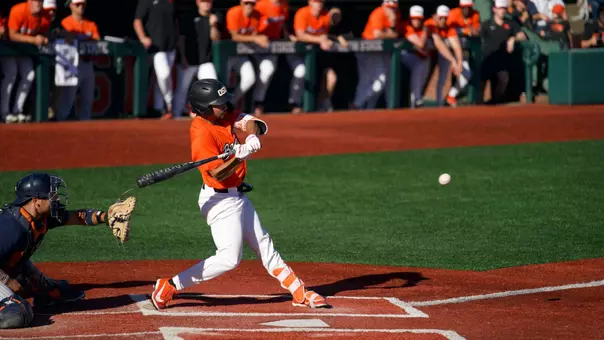 AJ Singer takes a swing on a pitch that he hit for a grand slam against Cal State Fullerton on April 18, 2026