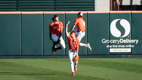 Three Beavers celebrate after Oregon State's win over Cal State Fullerton on April 18, 2026