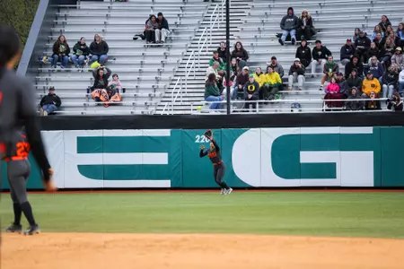 Mya Harrison making a catch in center field.