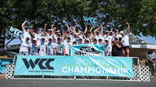 Women's rowing celebrating a WCC Championship.