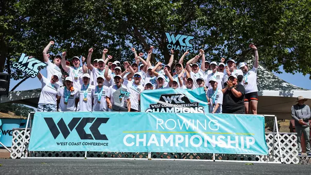 Women's rowing celebrating a WCC Championship.
