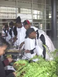 BASKETBALL TEAMS SERVE DINNER ON THANKSGIVING DAY Image