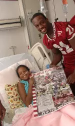 Dominique Harris Nominee for AFCA Good Works Team Image