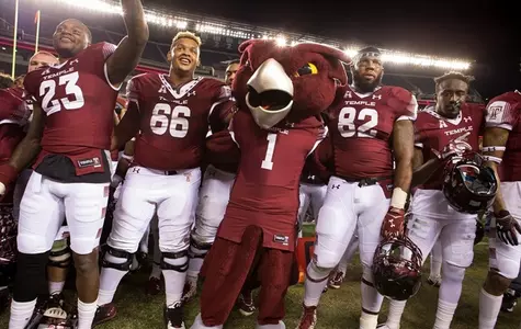 The Owls celebrate their 30-16 win over UCF