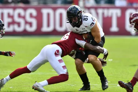 Cincinnati Bearcats tight end BRUNO LABELLE (87) is tackled by Temple Owls safety DAESEAN WATSON (16) during the American Athletic Conference football game played at Lincoln Financial Field in Philadelphia. Temple beat #20 Cincinnati 24-17 in overtime.