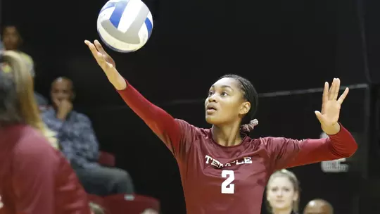 Peyton Boyd serves in a match against Radford