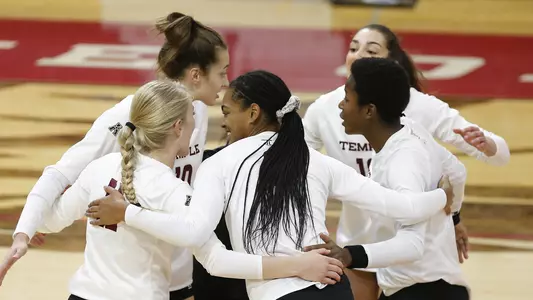 The Temple volleyball team celebrates a point against East Caroline on October 11.