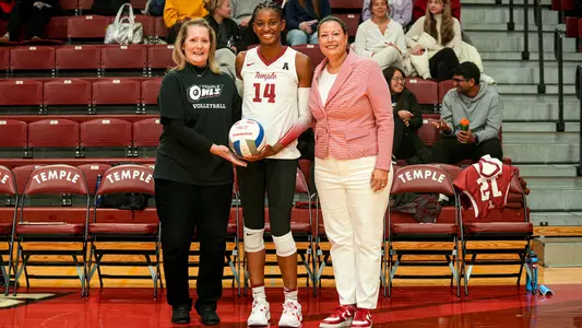 Mary Beth Wilson and Linda Hampton-Keith Gives Taylor Davenport her 1,000 career-kill ball