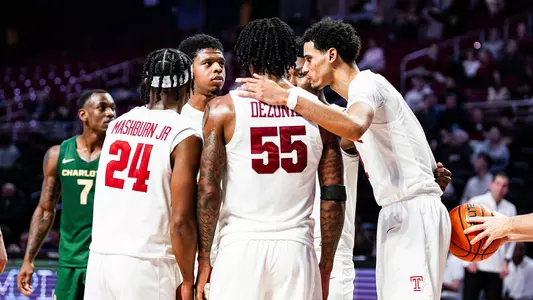 Jamal Mashburn Jr., Zion Stanford, Shane Dezonie, Quante Berry and Steve Settle III huddle against Charlotte on Jan. 29.