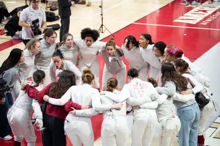Fencing team huddle