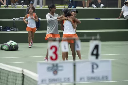 Lorraine Guillermo greeted by Khunpak Issara and Tara Panu after clinching victory.