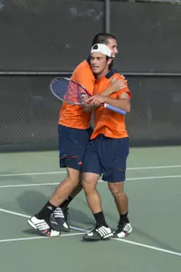 Mousheg Hovhannisyan receives a hug from Sebastian Fanselow after clinching the dual win today vs. BYU.